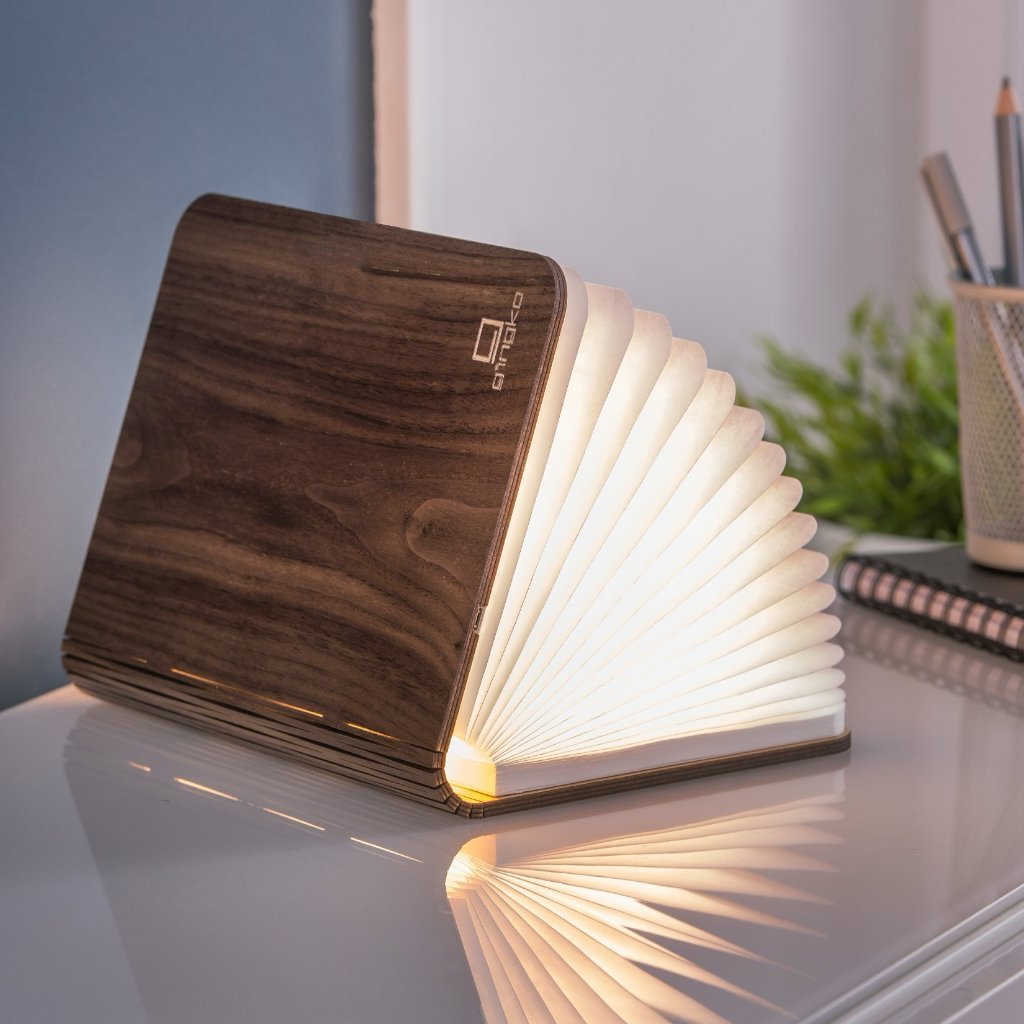 A clever concertina paged light which looks like a book. In walnut casing. When closed, 17W x 21.5H x 2.5cm