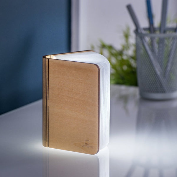 A clever concertina paged light which looks like a book. In maple wood casing. When closed, 9W x 12.2H x 2.5cm