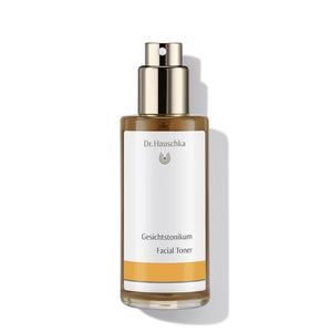 Dr Haushka glass bottle of facial toner, with gold plastic pump